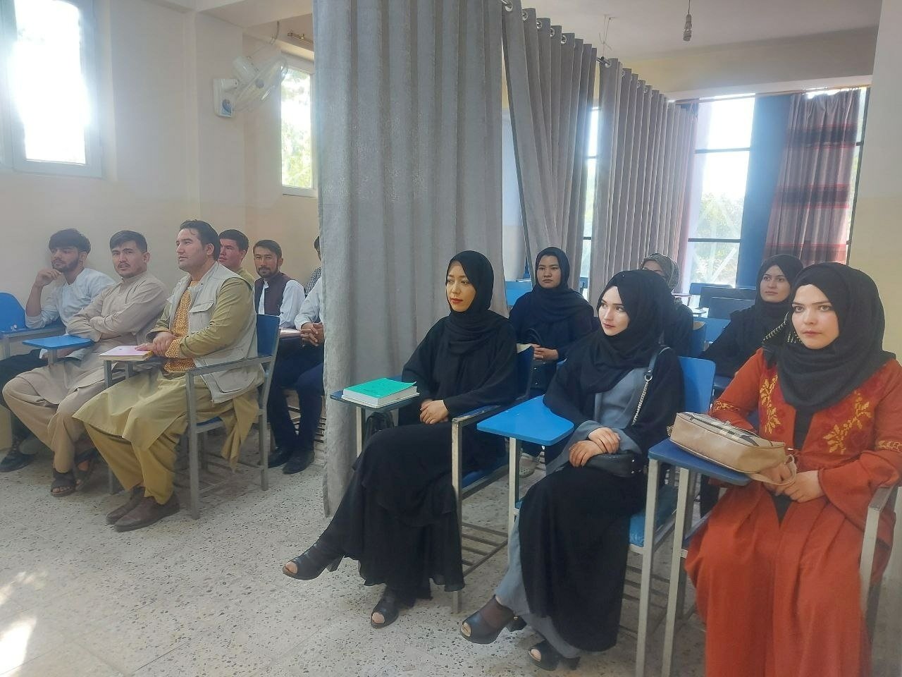 In this picture obtained from social media, students attend class under new classroom conditions at Avicenna University in Kabul, Afghanistan Sept. 6, 2021. (Reuters)