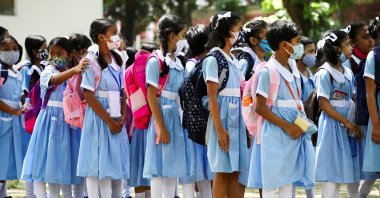 Students stand in queues after school hours at the Viqarunnisa Noon School & College after the government has withdrawn restrictions on educational institutions following a decrease in the number of cases of coronavirus disease (COVID-19) in Dhaka, Bangladesh, Sept. 12, 2021. (Reuters Photo)