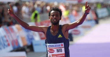 Ethiopia's Derara Hurisa celebrates after winning the Vienna City Marathon in Vienna, Austria, Sept. 12, 2021.