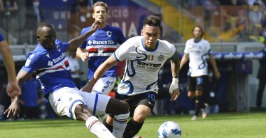 Inter's Lautaro Martinez (R) and Sampdoria's Omar Colley vie for the ball during a Serie A match at the Luigi Ferraris stadium in Genoa, Italy, Sept. 12, 2021. (AP Photo)