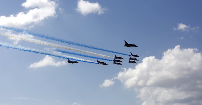 Two French Rafale fighter aircraft and the 'Patrouille de France' aerobatic display team fly above Acropolis Hill, in Athens, Greece, Sept. 6, 2021. (EPA Photo)