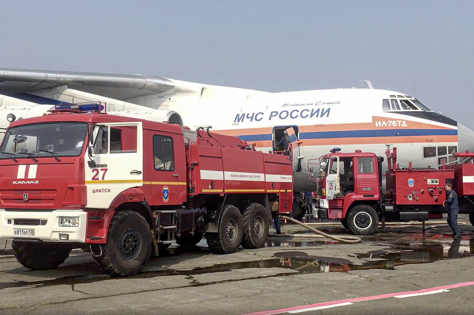 This image taken from a video provided by the Russian Ministry of Emergency Situations shows an IL-76 aircraft loading with water at an airfield in the Irkutsk region, Eastern Siberia, Russia, June 13, 2021. (AP File Photo)