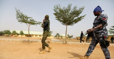 Police officers walk at the JSS Jangebe school, a day after over 300 school girls were abducted by bandits, in Zamfara, Nigeria Feb. 27, 2021. (Reuters Photo)