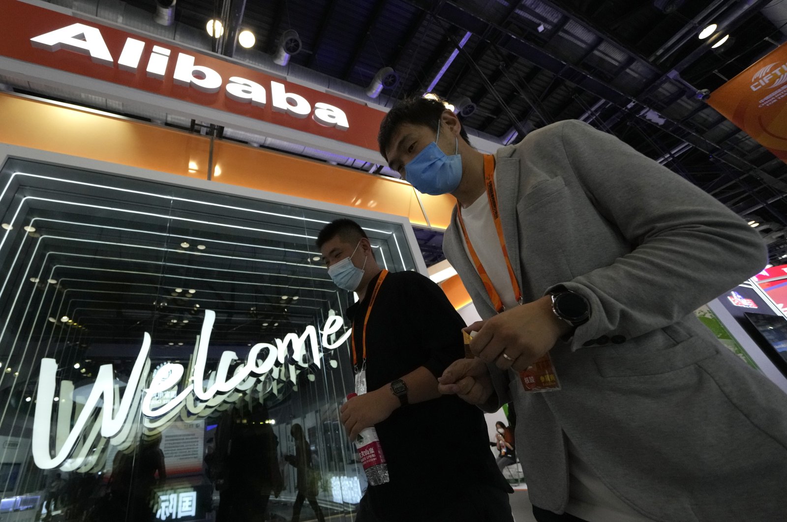 Visitors pass by the Alibaba booth during the China International Fair for Trade in Services (CIFTIS) in Beijing, China, Sept. 7, 2021. (AP Photo)