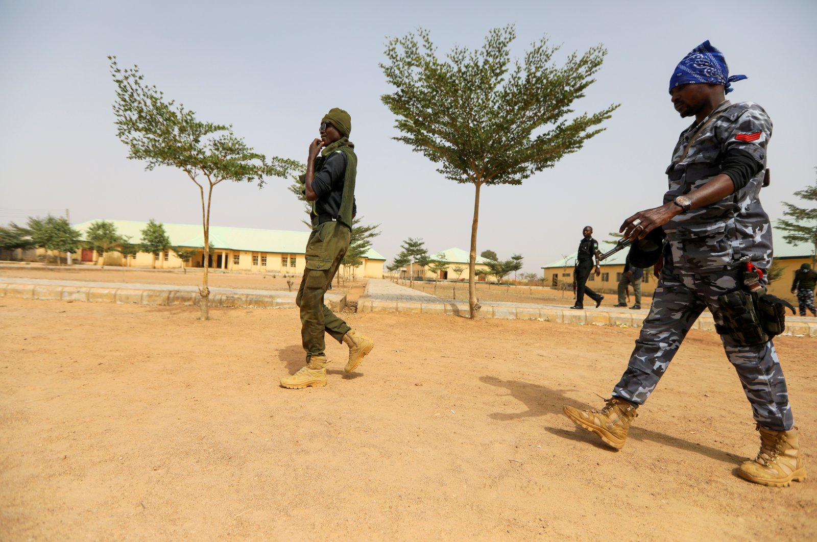Police officers walk at the JSS Jangebe school, a day after over 300 school girls were abducted by bandits, in Zamfara, Nigeria Feb. 27, 2021. (Reuters Photo)
