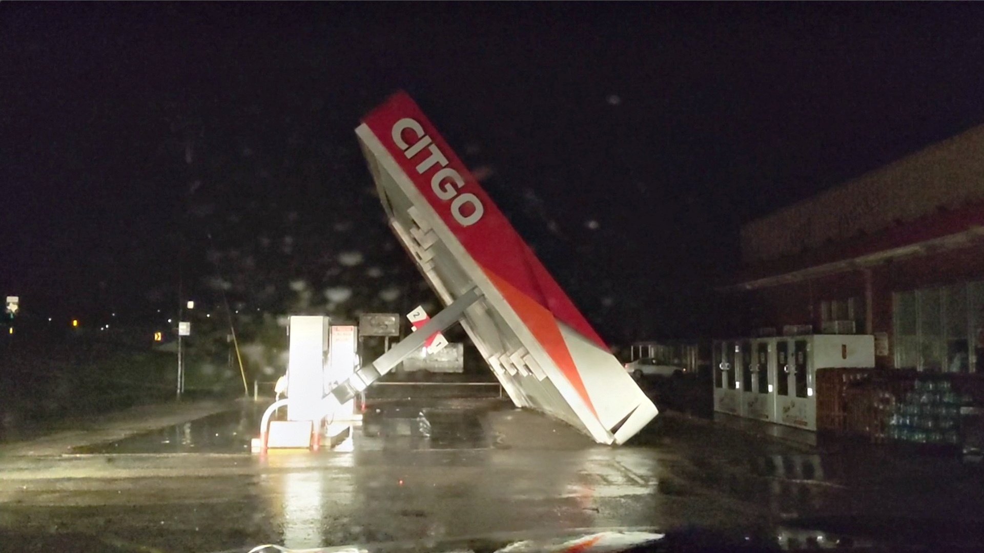 A CITGO gas station roof is blown away by Tropical Storm Nicholas in this still image from a social media video, Matagorda, Texas, U.S., Sept. 13, 2021. (Andrew Dubya via Reuters)