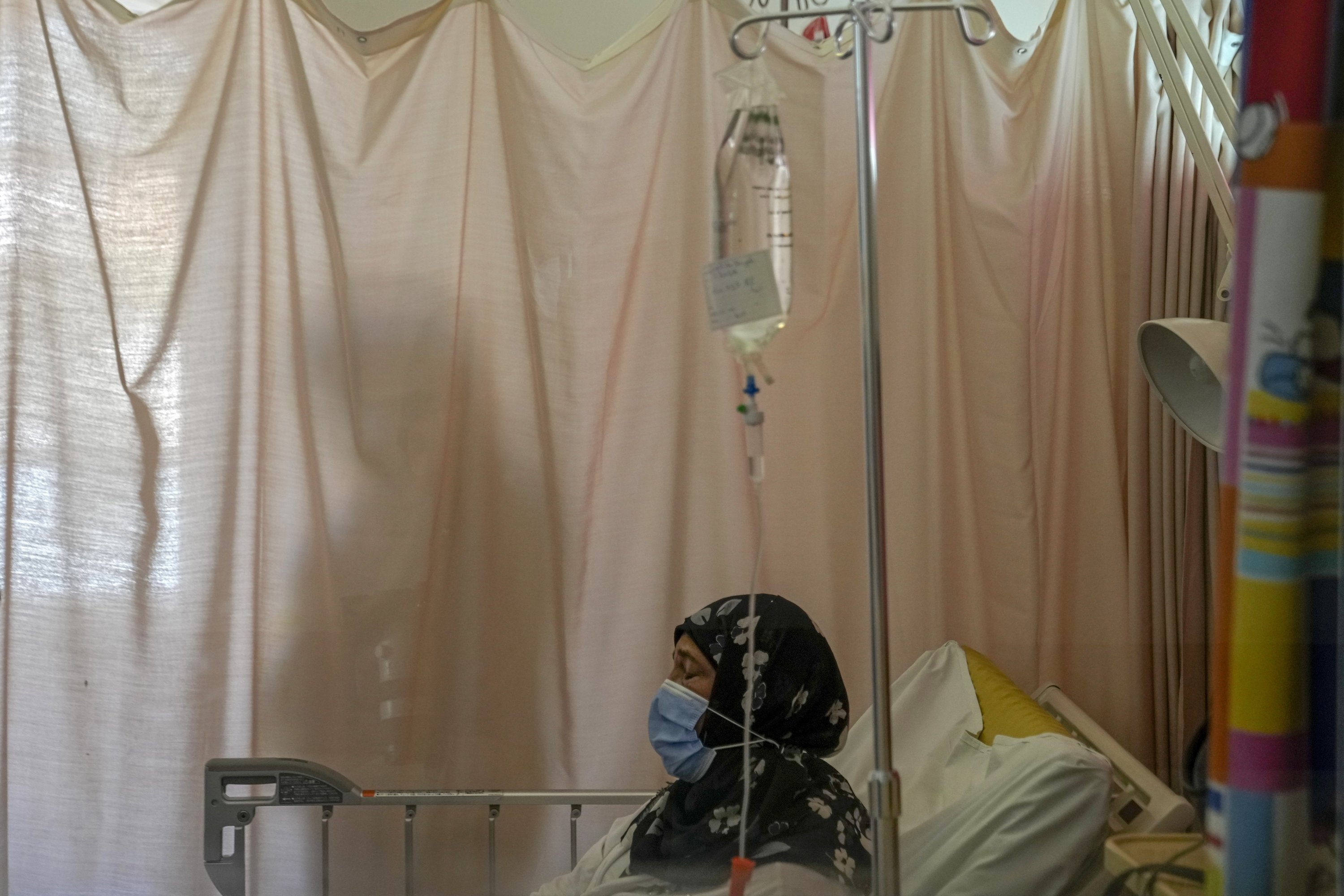 Wahiba Doughan waits to receive chemotherapy treatment for lung cancer at the government-run Rafik Hariri University Hospital in Beirut, Lebanon, Sept. 8, 2021. (AP Photo)