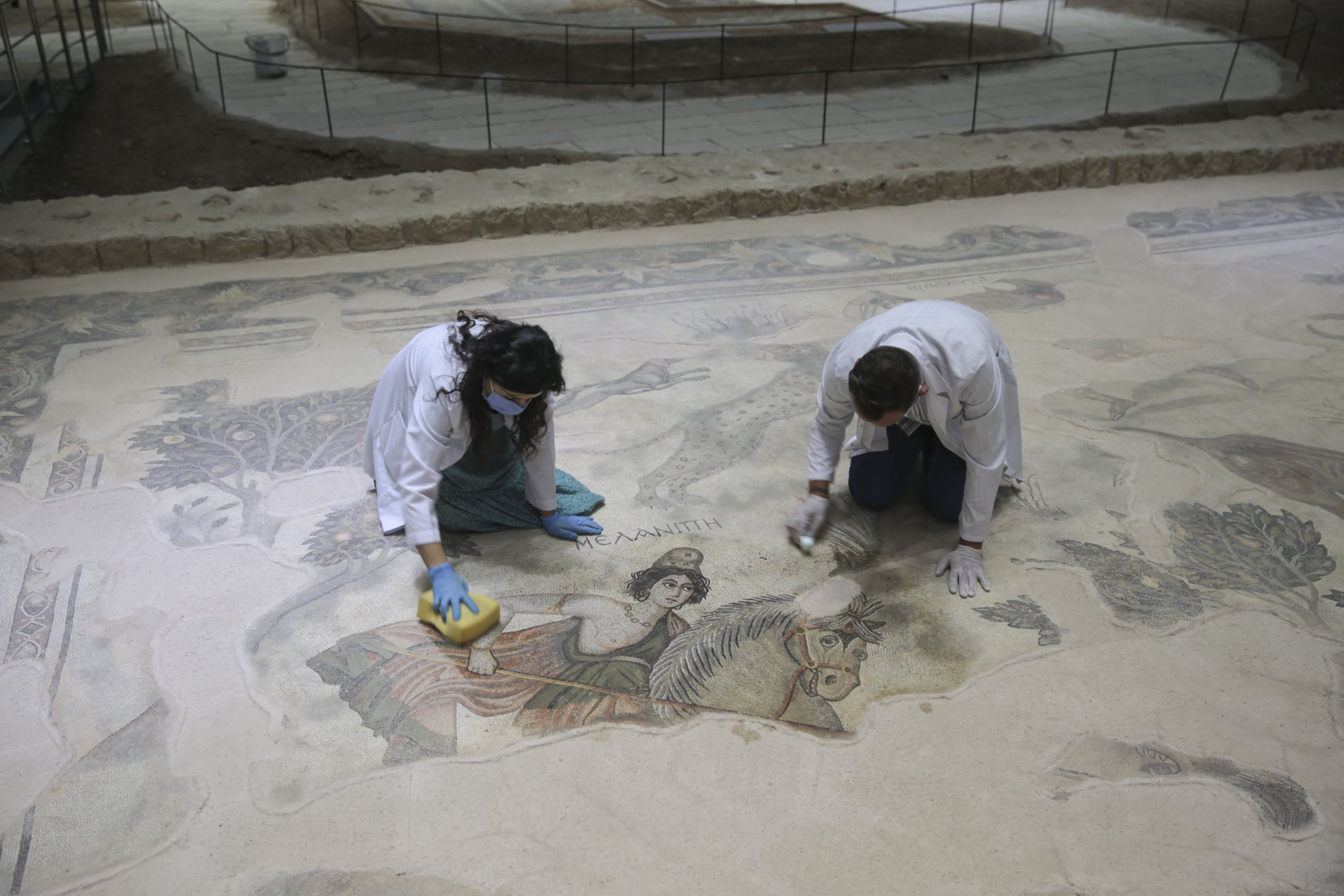 Experts work on a mosaic at the Şanlıurfa Archaeology Museum, southeastern Turkey, Sept. 12, 2021. (AA Photo) 