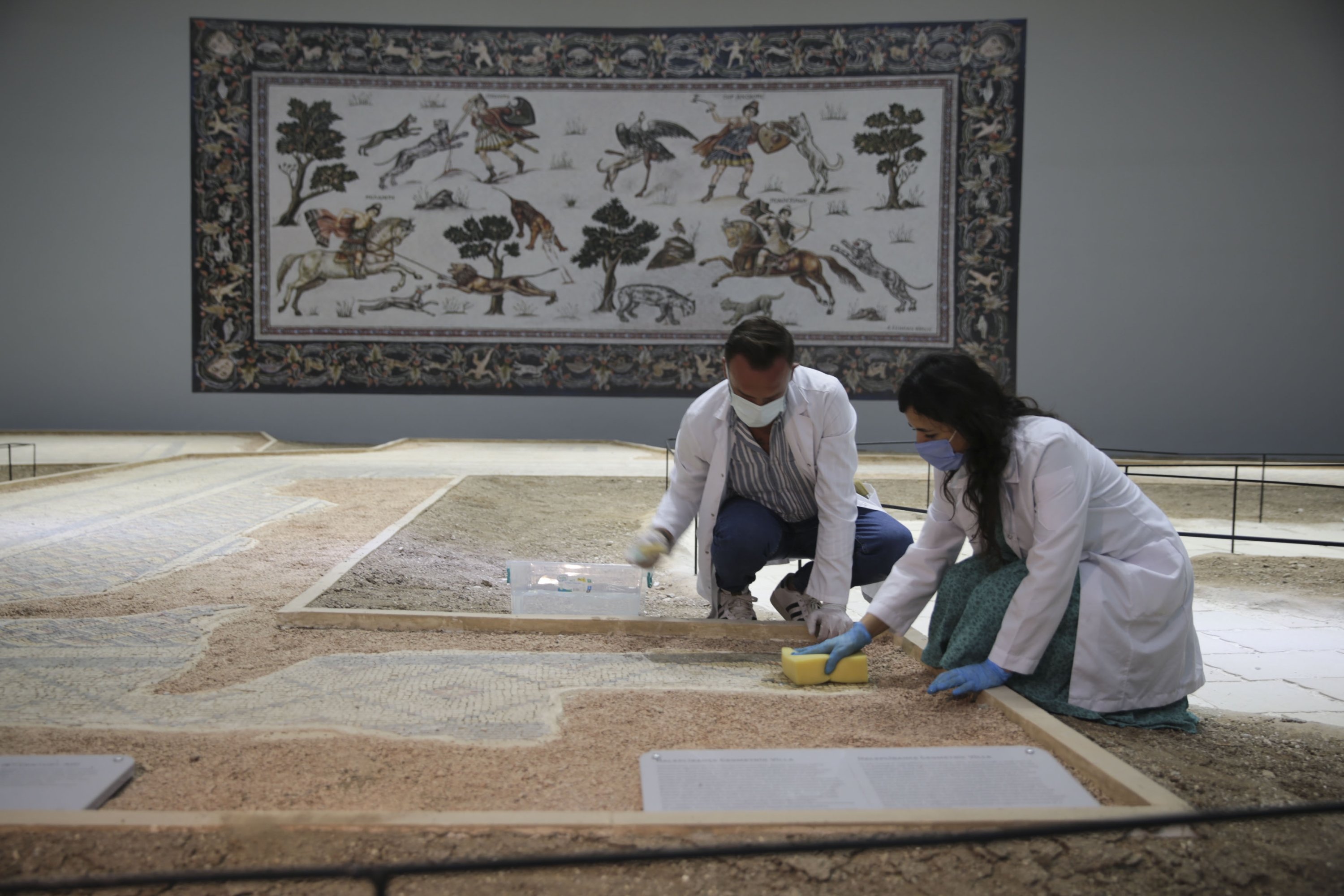 Experts work on a mosaic at the Şanlıurfa Archaeology Museum, southeastern Turkey, Sept. 12, 2021. (AA Photo) 