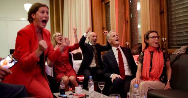 Labour leader Jonas Gahr Store cheers after seeing the exit poll during the Labour Party's election party at Folkets hus in the 2021 Norwegian parliamentary elections, in Oslo, Norway, Sept. 13, 2021. (AP Photo)