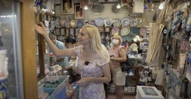 YouTuber Chelsea Elizabeth inspects items in a shop in Izmir, Turkey. (Photo from YouTube's Chelsea Elizabeth)