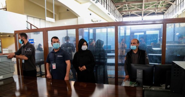 Afghan airport staff work at the security check at Hamid Karzai International Airport in Kabul, Afghanistan, Sept. 13, 2021. (EPA Photo)