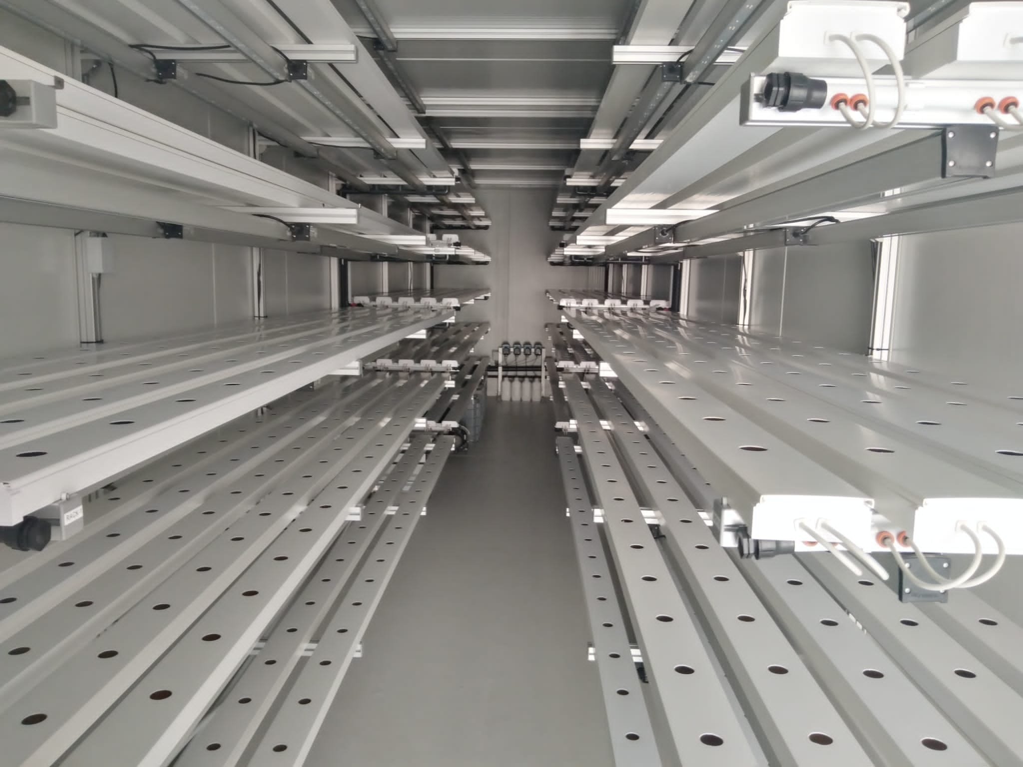 Layers of shelves are seen inside a mobile container farm of CY Group.