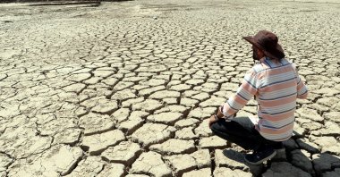 A man looks at a stretch of dried land in Van, eastern Turkey, Sept. 9, 2021. (DHA PHOTO) 