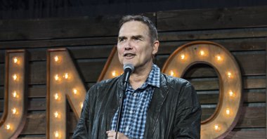 Stand-up comedian Norm Macdonald, who died after a nine-year battle with cancer that he kept private, appearing for a live show at KAABOO 2017 in San Diego, California, U.S., Sept. 16, 2017.  (AP File Photo)