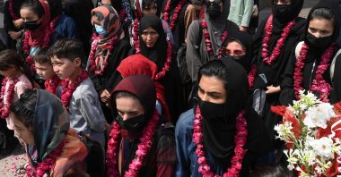 Members of Afghanistan's national women's football team arrive at the Pakistan Football Federation (PFF) in Lahore, Pakistan, Sept. 15, 2021. (AFP Photo)
