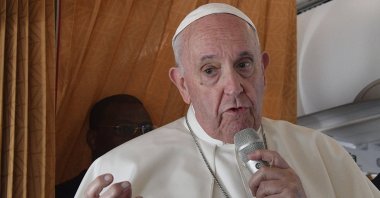 Pope Francis speaks with journalists on board an Alitalia aircraft en route from Bratislava back to Rome, Sept. 15, 2021, after a four-day pilgrimage to Hungary and Slovakia. (Pool via AP)