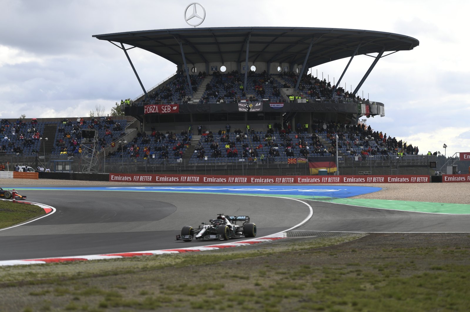 Mercedes driver Lewis Hamilton steers his car to win the Eifel Formula One Grand Prix at the Nurburgring racetrack in Nurburg, Germany, Oct. 11, 2020. (AP Photo)