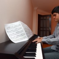 Buğra Çankır plays piano at home, in the capital Ankara, Turkey, Sept. 16, 2021. (AA PHOTO) 