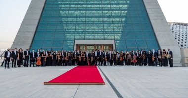Members of the Presidential Symphony Orchestra stand in front of the new CSO building, Ankara, Turkey, Sept. 16, 2021. (AA Photo)