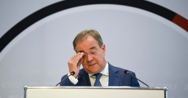 North Rhine-Westphalia's State Premier Armin Laschet, leader of the conservative Christian Democratic Union (CDU) and candidate for chancellor, fixes his glasses at a press conference in Stuttgart, southern Germany, Sept. 15, 2021. (AFP Photo)
