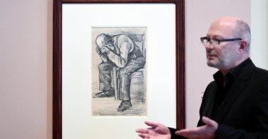 Senior researcher Teio Meenendorp unveils the unseen artwork by Vincent van Gogh that is named "Worn Out" at The Van Gogh Museum in Amsterdam, Netherlands, Sept. 16, 2021. (Reuters Photo)