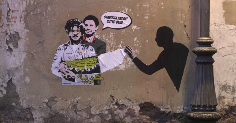 A mural depicting detained Egyptian human rights advocate and student at the University of Bologna in Italy Patrick George Zaki, being hugged from behind by Italian researcher Giulio Regeni, who was murdered in Cairo in 2016, is displayed on a wall in Rome, Italy, Feb. 19, 2020.(AP Photo)