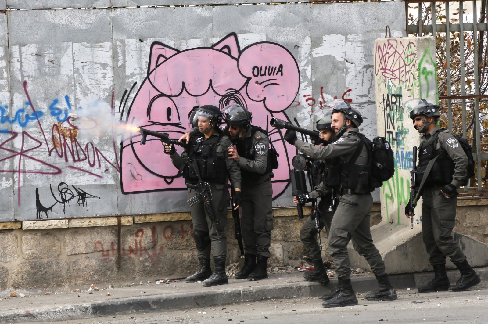 Israeli border police officers shoot tear gas during a demonstration in Bethlehem, occupied West Bank, Palestine, Dec. 22, 2017. (AP Photo)