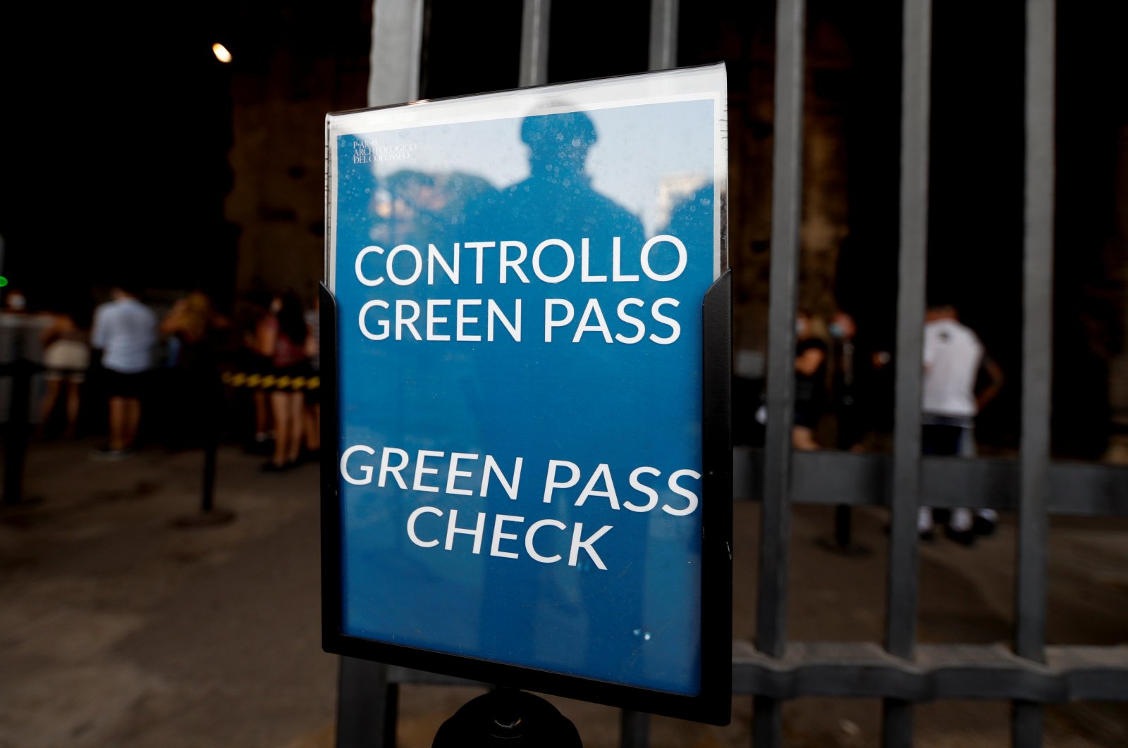 A sign indicates where tourists must show their "Green Passes," a document showing proof of COVID-19 immunity, upon entering the Colosseum, in Rome, Italy, Sept. 16, 2021. (Reuters Photo)