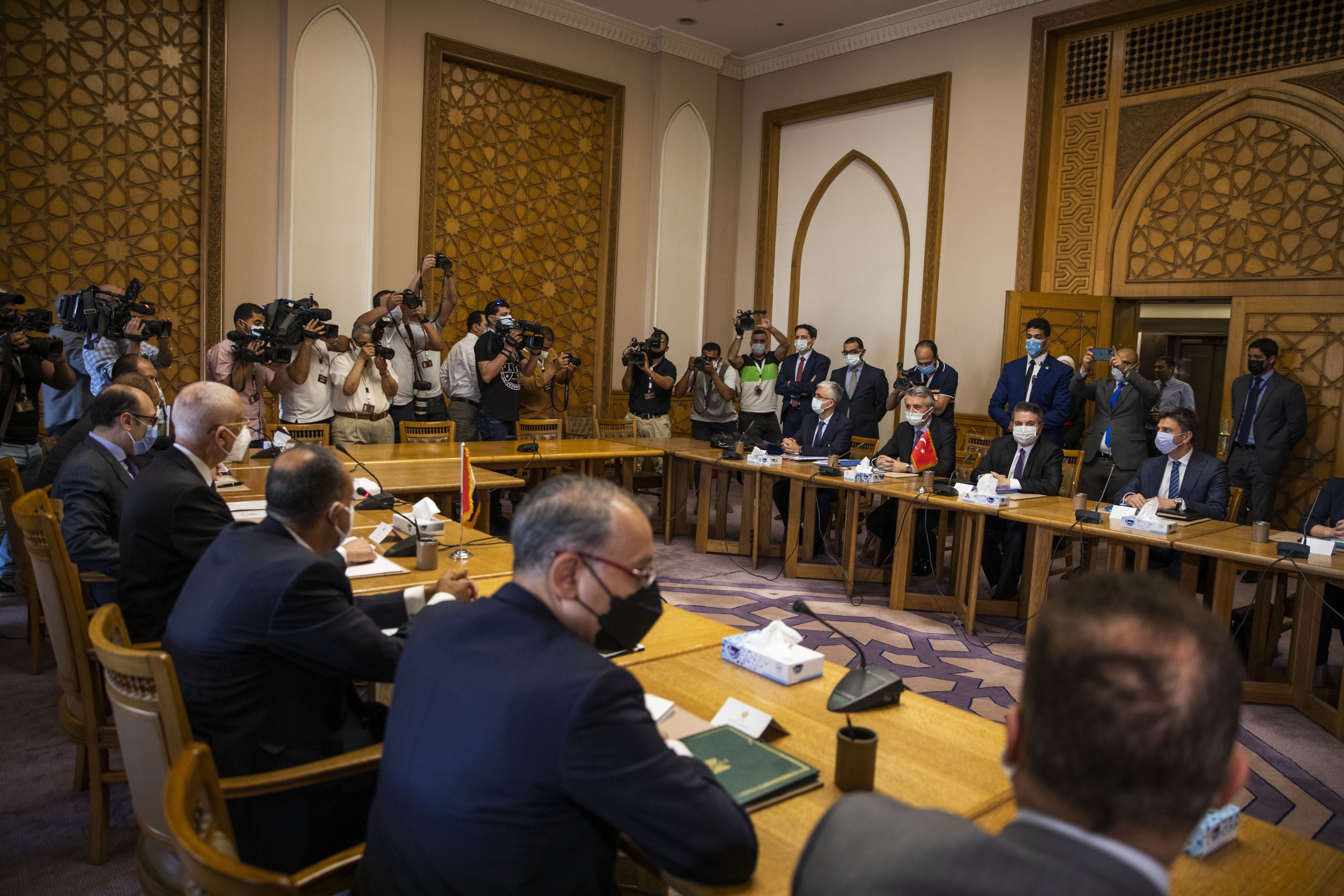 Turkish Foreign Ministry Deputy Sedat Onal, seated (2-R), meets with Hamdi Sanad Loza, Egyptian deputy foreign minister, (4-L), and their delegations, at the Foreign Ministry in Cairo, Egypt, May 5, 2021. (AP Photo)