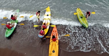 Russian bloggers enjoy a canoe tour in Muğla province, southwestern Turkey, Sept. 16, 2021. (AA Photo)