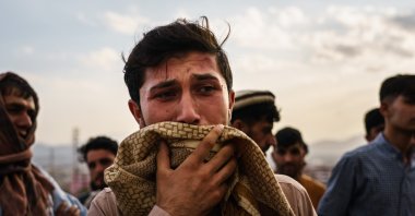 A man weeps during a mass funeral for a members of a family was killed in a U.S. drone airstrike, in Kabul, Afghanistan, Aug. 30, 2021. (Getty Images)