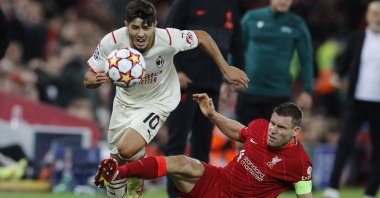 AC Milan's Brahim Diaz in action with Liverpool's James Milner during a Champions League match at Anfield, Liverpool, England, Sept. 15, 2021.