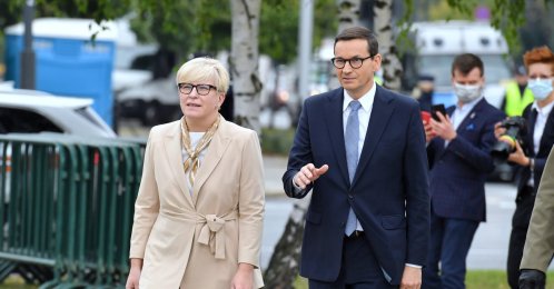 Poland's Prime Minister Mateusz Morawiecki (R) and Prime Minister of the Republic of Lithuania Ingrida Simonyte (L) walk in front of the Monument to the Fallen and Murdered in the East, in Warsaw, Poland, Sept. 17, 2021. (EPA Photo)