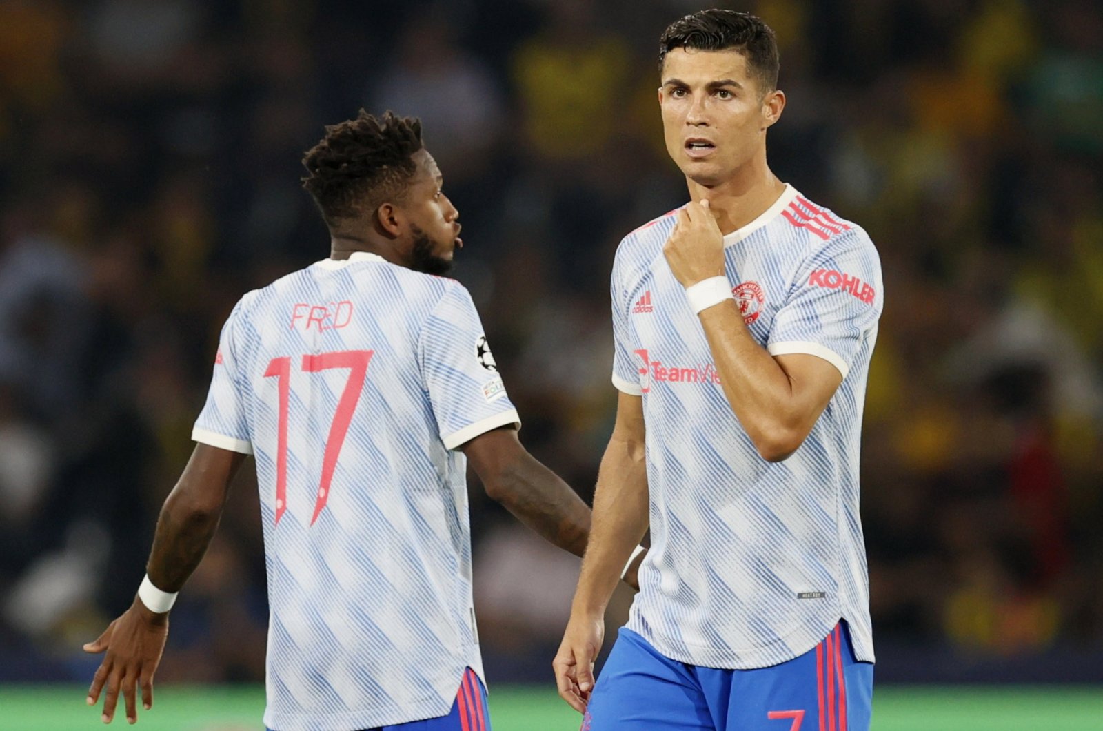 Manchester United's Cristiano Ronaldo (R) and Fred during a Champions League match against Young Boys at Stadion Wankdorf, Bern, Switzerland, Sept. 14, 2021.
