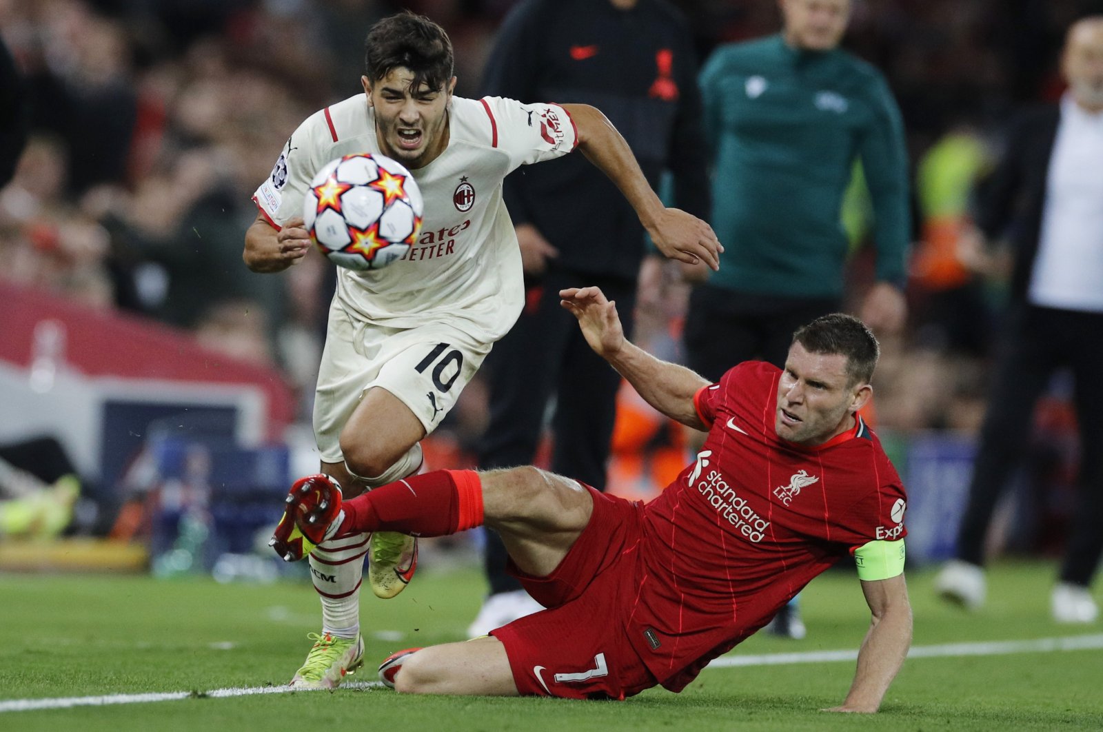 AC Milan's Brahim Diaz in action with Liverpool's James Milner during a Champions League match at Anfield, Liverpool, England, Sept. 15, 2021.