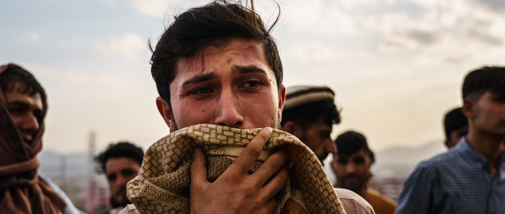 A man weeps during a mass funeral for a members of a family was killed in a U.S. drone airstrike, in Kabul, Afghanistan, Aug. 30, 2021. (Getty Images)