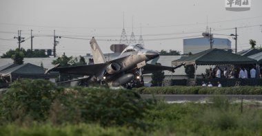 A handout photo made available by the Taiwan Ministry of National Defense shows a Taiwanese Air Force IDF fighter jet take-off on a highway converted as a runway during the Emergency Take-off and Landing drill in Pingtung, Taiwan, Sept. 15, 2021. (EPA Photo)