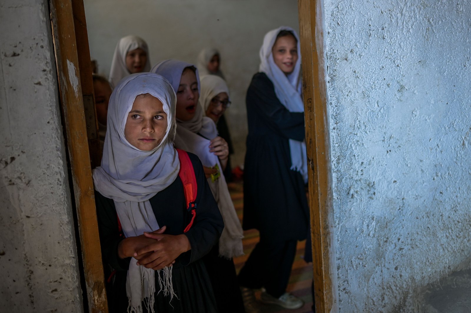 Schoolgirls gather at their class after arriving at a gender-segregated school in Kabul, Afghanistan, Sept. 15, 2021. (AFP Photo)