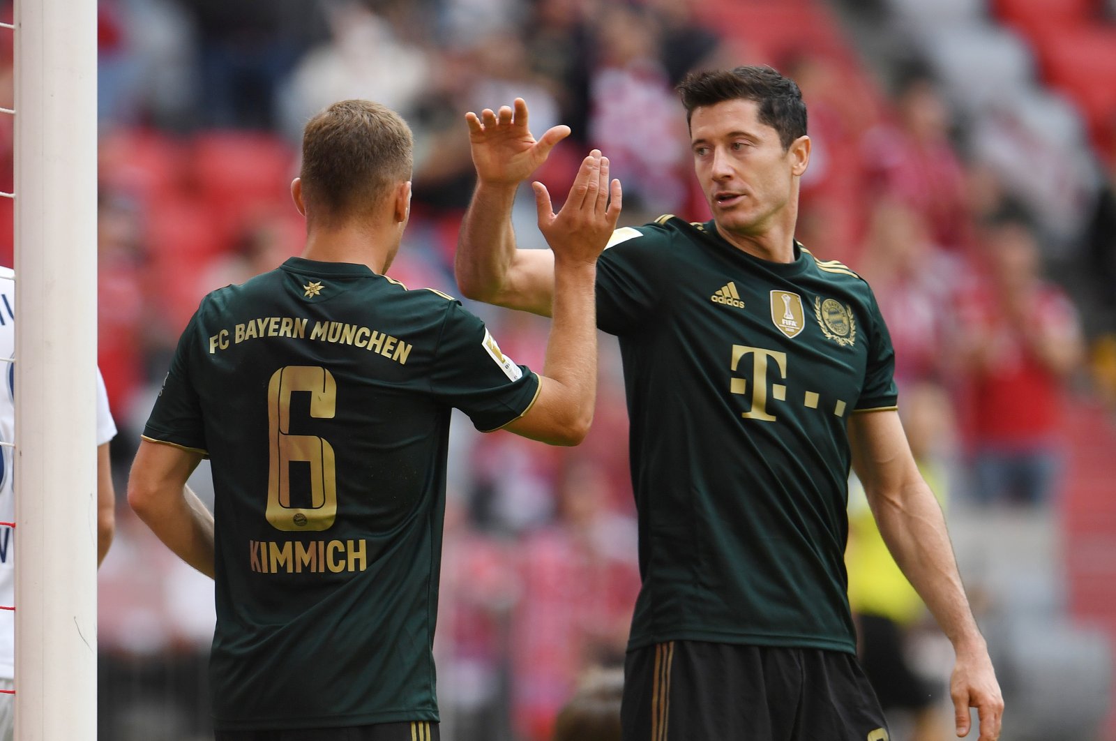 Bayern Munich's Joshua Kimmich celebrates scoring their sixth goal with Robert Lewandowski, Munich, Sept. 18, 2021. (Reuters Photo)