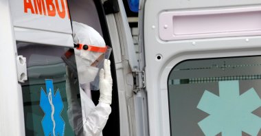 A medical worker is seen in an ambulance at the entrance of the Cardarelli hospital, amid the outbreak of COVID-19 in Naples, Italy, Nov. 12, 2020. (Reuters Photo)