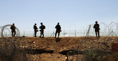 Israeli soldiers guard a fence leading to the Israeli-occupied West Bank, as part of search efforts to capture six Palestinian men who had escaped from Gilboa prison earlier this week, by the village of Muqeibila in northern Israel, Sept. 9, 2021. (Reuters Photo)