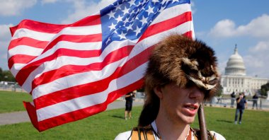 A man wearing a raccoon hat talks about his belief that former U.S. President Donald Trump won the election and that it was stolen from him through fraud, during a rally in support of defendants being prosecuted in the Jan. 6 attack on the Capitol, in Washington, D.C., U.S., Sept. 18, 2021. (REUTERS Photo)