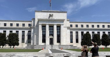 People take pictures of the U.S. Federal Reserve (Fed) building in Washington, D.C., U.S., Aug. 6, 2021. (AFP Photo)