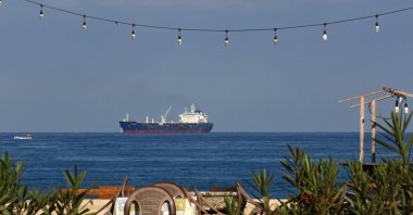 An oil tanker carrying fuel oil from Iraq, is seen anchored near the Zahrani power plant in Zahrani near the southern Lebanese city of Saida, Sept. 18, 2021. (AFP Photo)