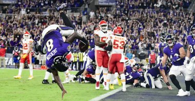 Baltimore Ravens quarterback Lamar Jackson (8) flips into the end zone for a fourth-quarter touchdown against the Kansas City Chiefs at M&T Bank Stadium, Baltimore, Maryland, U.S., Sept. 19, 2021. (Tommy Gilligan-USA TODAY Sports via REUTERS)