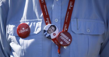 A supporter wears a pin depicting Liberal Party Leader Justin Trudeau during a campaign stop in Niagara Falls, Canada, Sept. 19, 2021 (AFP Photo)