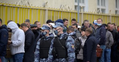 People queue outside a polling station to vote on the first day of the three-day parliamentary election in Moscow, Russia, Sept. 17, 2021. (AFP Photo)