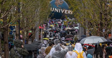 Visitors walk to the entrance to Universal Studios Beijing on the official opening day, in Beijing, China, Sept. 20, 2021. (EPA Photo)