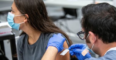 OSU student Ashlyn Gerlach of Saint Henry, Ohio, receives her second dose of the Pfizer coronavirus vaccine at a clinic at Ohio State University in Columbus, Ohio, U.S., Sept. 15, 2021. (Reuters Photo)